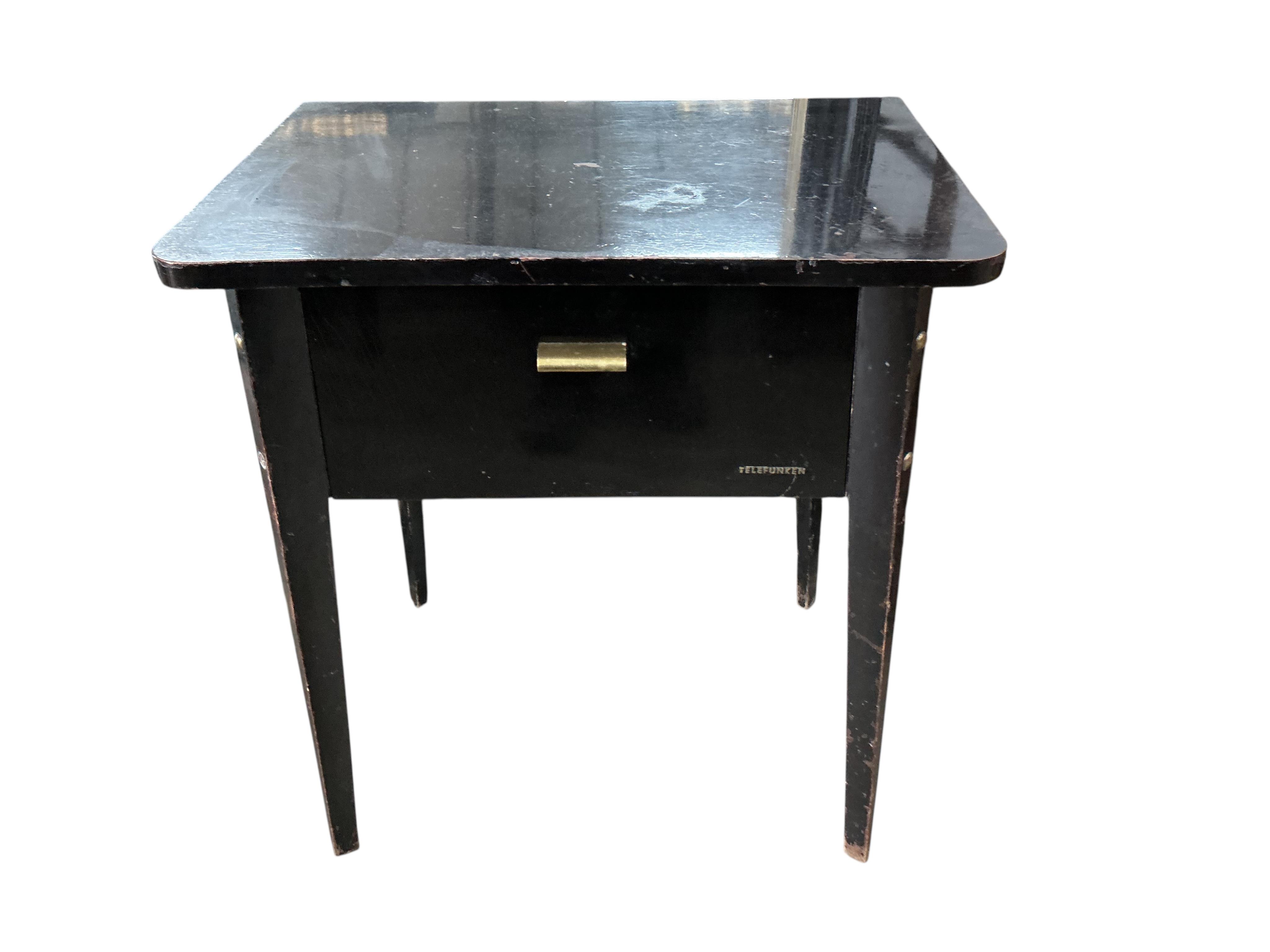 A mid century ebonised Telefunken record player with booklet, width 62cm, depth 43cm, height 68cm